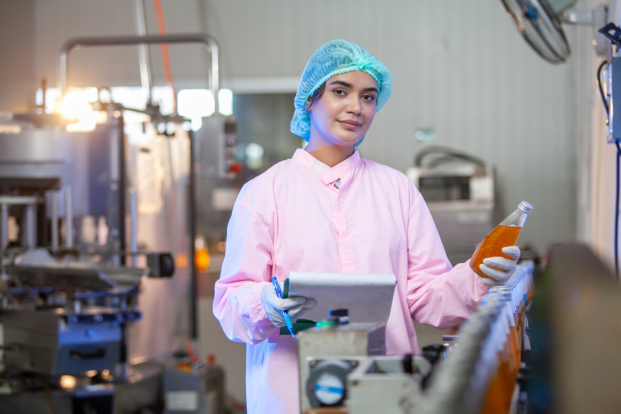 asian-woman-worker-is-checking-product-bottles-of-2023-11-27-05-04-35-utc